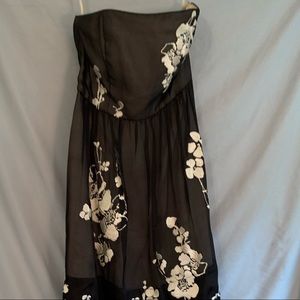 Black dress with embroidered white flowers